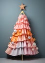 Alternative fashion Christmas tree, Pastel colored fabric gathered in soft ruffles hangs on a hanger in the shape of a