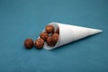 Alternative fruit candy sugar free. Energy balls with dried date fruits and carob powder. Vegetarian round candies on blue Royalty Free Stock Photo