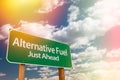 Alternative Fuel Green Road Sign Against Cloudy Sky