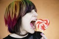 Alternative Girl Eating a Heart Lollipop Royalty Free Stock Photo