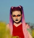 Gothic girl, tattoo`s braided hair,eye make-up