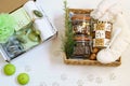 Alternative homemade gift boxes with eucalyptus cosmetics products, coffee, coffee cup, chocolate and warm socks. Christmas Royalty Free Stock Photo