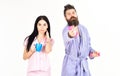 Alternative lifestyle concept. Couple, family offers alternative energy source. Couple in love in pajama, bathrobe stand