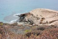 Caves and straw huts, life on the beach Royalty Free Stock Photo