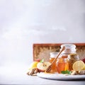 Alternative medicine concept. Ingredients for flu fighting natural hot drink. Copy space. Lemon, ginger, mint, honey, apple and Royalty Free Stock Photo