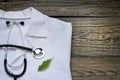 Alternative medicine stethoscope and green symbol background