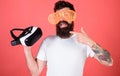 Alternative reality. Man making decision what choose real or virtual. Man bearded hipster with virtual reality headset