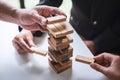 Alternative Risk and Strategy in Business, Hand of business team cooperative gambling placing making wooden block hierarchy on the Royalty Free Stock Photo