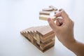 Alternative Risk and Strategy in business to make growth, Image of Business man`s hand placing making a wooden block stacking