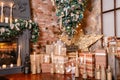 Alternative tree upside down on the ceiling. Winter home decor. Christmas in loft interior against brick wall. Royalty Free Stock Photo