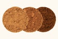 Alternative type of processed cocoa. Three piles of cocoa powder of different colors on a beige background. Comparison of dutch Royalty Free Stock Photo