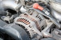 Alternator. Close up detail of a Flat-four car engine compartment under the open hood