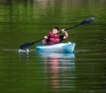 Althom, Pennsylvania, USA May 28, 2022 A boy paddling a kayak on the Allegheny River