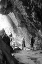 Hikers at stone formations in the tropical forest of Cuba`s Nationalpark Altiplano Topes des Collantes