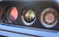 Altitude, inclinometer or clinometer  measure in SUV off road vehicle dashboard covered with red dust from driving in desert Royalty Free Stock Photo