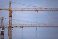 Altitudinal construction cranes and building construction site Royalty Free Stock Photo