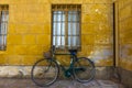 2022 05 15 Altivole bicycle on yellow wall Royalty Free Stock Photo