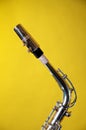 Alto Saxophone Neck Isolated on Yellow