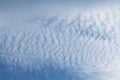 Altocumulus undulatus cloud. Sky with white wavy clouds Royalty Free Stock Photo