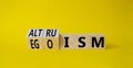 Altruism and Egoism symbol. Turned wooden cubes with words Egoism and Altruism. Beautiful yellow background. Business,