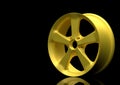 Aluminium alloy car wheel. Gold alloy rim for car, tracks on black background