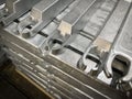 Aluminium alloy ingots stacked in the foreground, high-pressure die casting material, raw material, resources for the industry Royalty Free Stock Photo