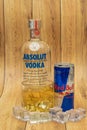 Aluminium can of Red Bull Energy drink with ice and drops, Vodka Absolut. Red Bull is the most popular energy drink in the world. Royalty Free Stock Photo