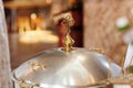 Aluminium church font, large bowl, with golden cross and saint water for the baptism of babies in Orthodox Church temple