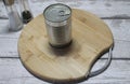 Aluminium tin can on a wooden chopping board Royalty Free Stock Photo