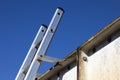 Aluminium ladder securely fastened at top