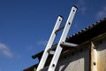 Aluminium ladder securely fastened at top