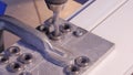 Hole being drilled into aluminium and metal using electric drill. Aluminium or metal drilling closeup in metal workshop