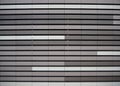 Aluminium metal facade cladding texture, with the colors white, light gray and dark gray