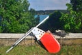 Aluminium and plywood rudder of a small sailboat with a pair of old sailing shoes