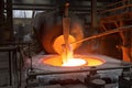 aluminium smelting process, with molten metal flowing from furnace