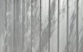 Aluminium wall with tree shadows texture background Royalty Free Stock Photo