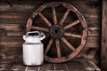 Aluminium water can and old wheel