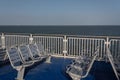 Aluminum bench seats and deck railing on a ferry ship