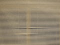 Aluminum blinds covered with secure net on dark background