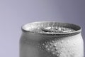 Aluminum can of  covered with water drops on grey background, closeup. Space for text Royalty Free Stock Photo