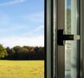 Aluminum door window closeup view, blurry background