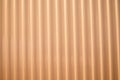 Aluminum fence. Corrugated metal profiled panel. Background of orange metal siding, corrugated iron sheet for decoration Royalty Free Stock Photo