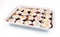 Aluminum foil tray filled with Easter cakes of homemade cakes, d