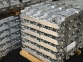 Aluminum ingots stacked on a pallet, raw material, aluminum alloy ready to be processed Royalty Free Stock Photo