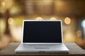 Aluminum Laptop on a wooden table Royalty Free Stock Photo