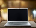 Aluminum Laptop on a wooden table Royalty Free Stock Photo