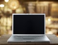 Aluminum Laptop on a wooden table Royalty Free Stock Photo