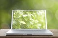 Aluminum Laptop on a wooden table Royalty Free Stock Photo