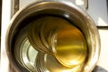 Aluminum lids lie in hot water in a saucepan are sterilized to preserve