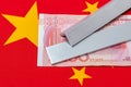 Aluminum metal, 100 yuan bill and flag of China Royalty Free Stock Photo